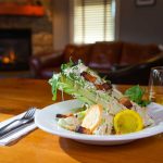 Caesar salad and wine at Fernie's Smokehouse